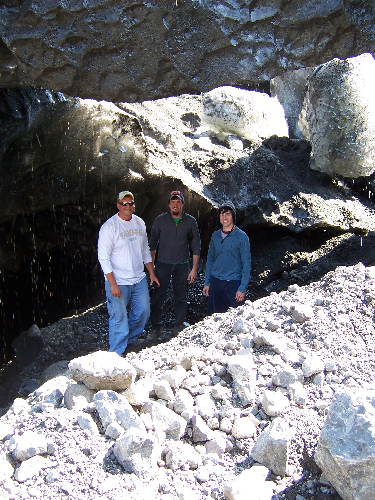 Todd, Rob, and Adam standing in a glacial cave.