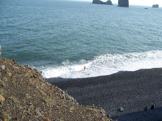 Rob (in the red trunks) searches for the lava source while his comrades (lower right corner) observed his methods.