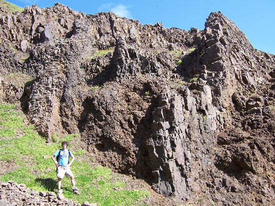 Dikes intruding lavas - Adam for scale.