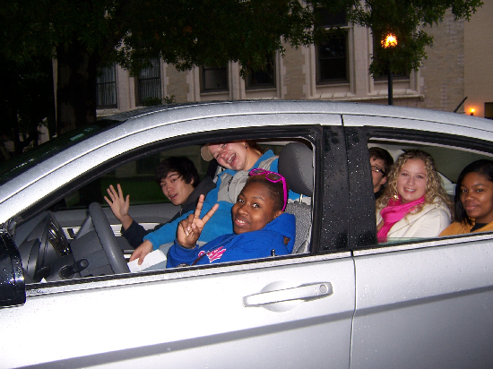Students piled into one car while waiting leave early on Saturday morning. They eventually squeezed 8 bodies into this vehicle. Talk about a tightly-knit group! 