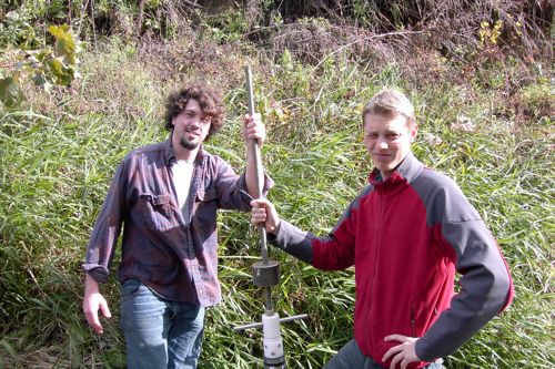 Rob and Palmer pose with coring device that they used to recover a sediment core from the bottom of the Killbuck River where is has downcut into the blue lake clay sediments. The blue clay is the confing layer of the Wooster buried valley aquifer.
