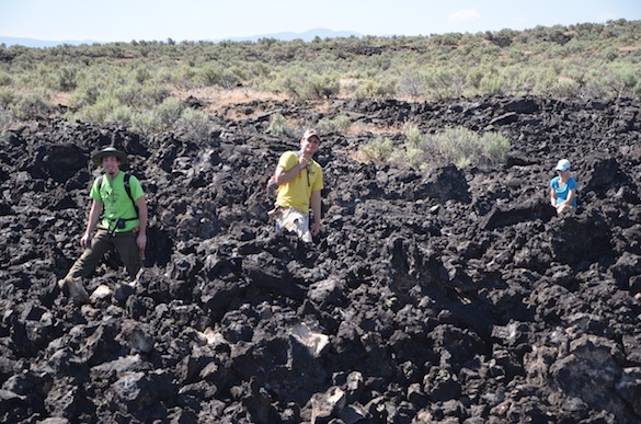 Cam Matesich ('14, Wooster), Ben Hinks ('14, Albion, and Tricia Hall ('14, Wooster) looking for samples in an 'a'a lava flow in Cam's field area. Credit: T. Wilch