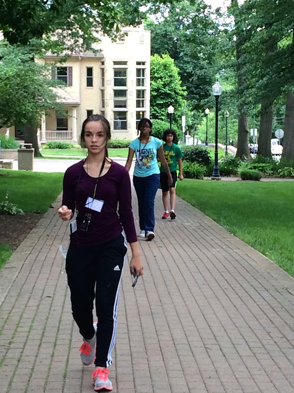 B-WISER girls focus intently on measuring distances on the academic quad with their paces.