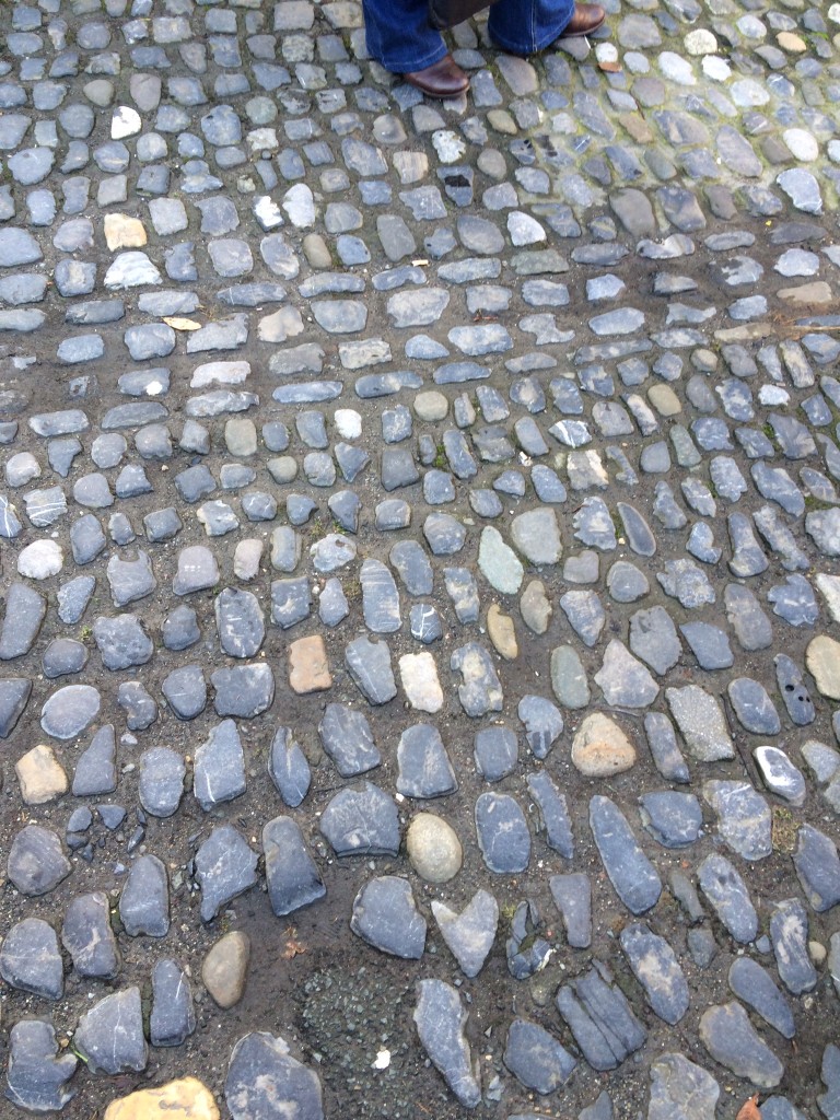 The floor of the square is paved with polished glacial cobbles of a variety of lithologies, including limestone and andesite.