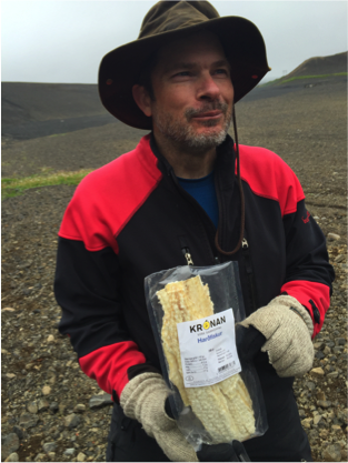 Ben with Harðfiskur. The dried fish has an incredibly potent smell that we cannot get out of the van.